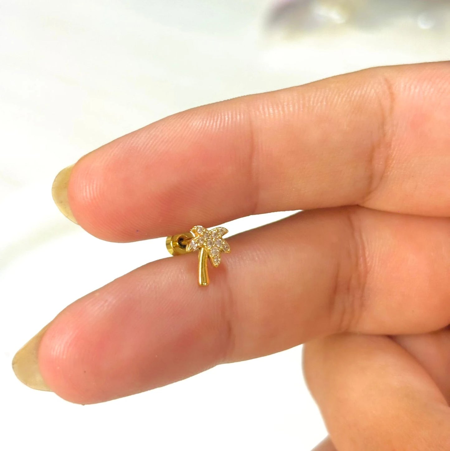 Golden Palm Ear Piercing