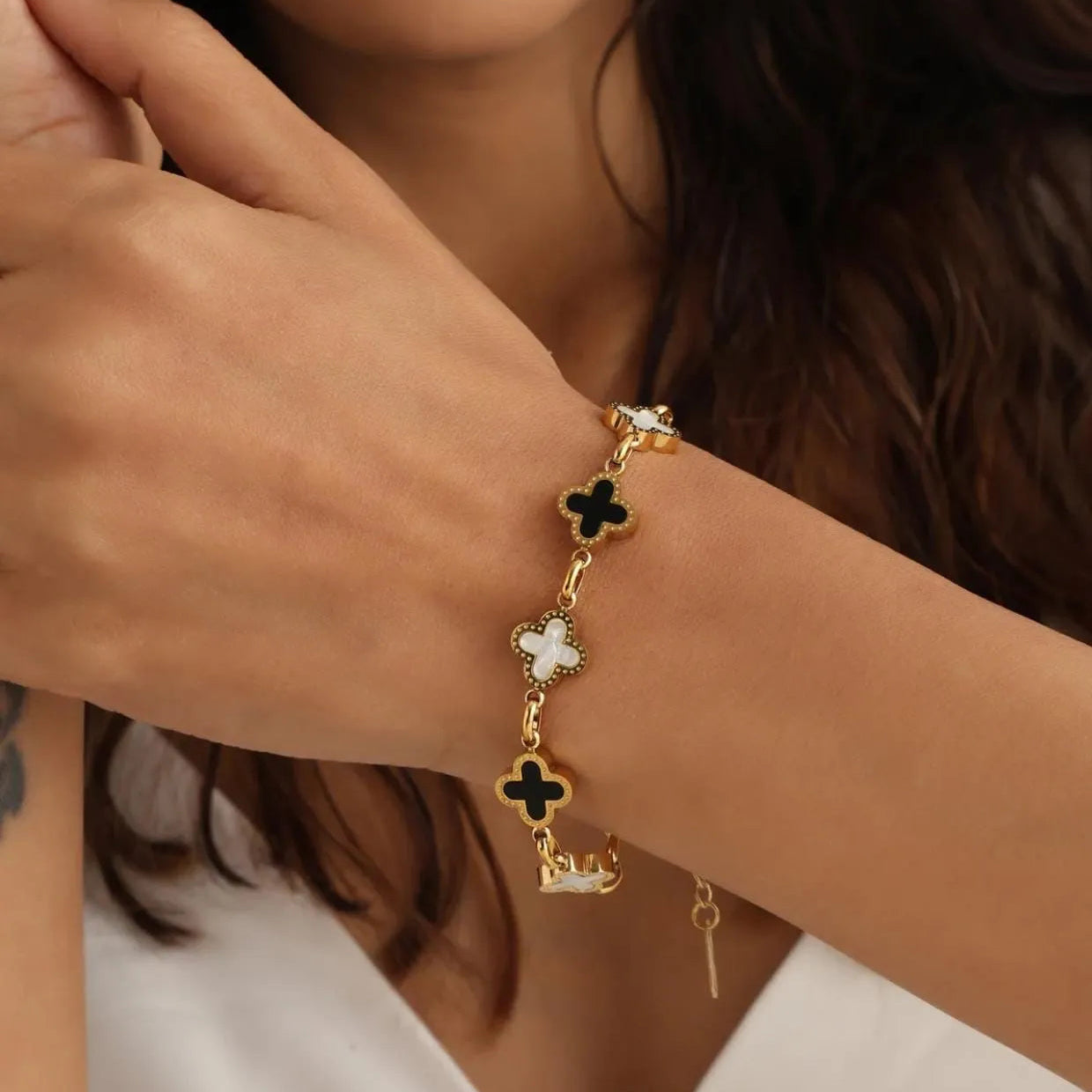Elegant Gold-Plated Bracelet with Black and White Clovers