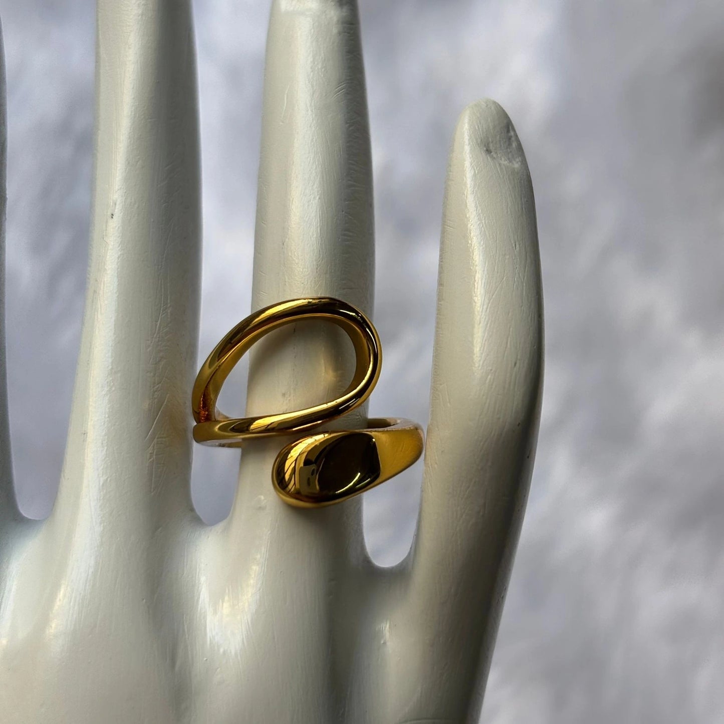 Modern gold curve ring