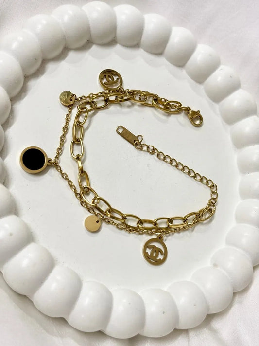 Gold Chain Bracelet with Black Charm and Signature Logo Accents