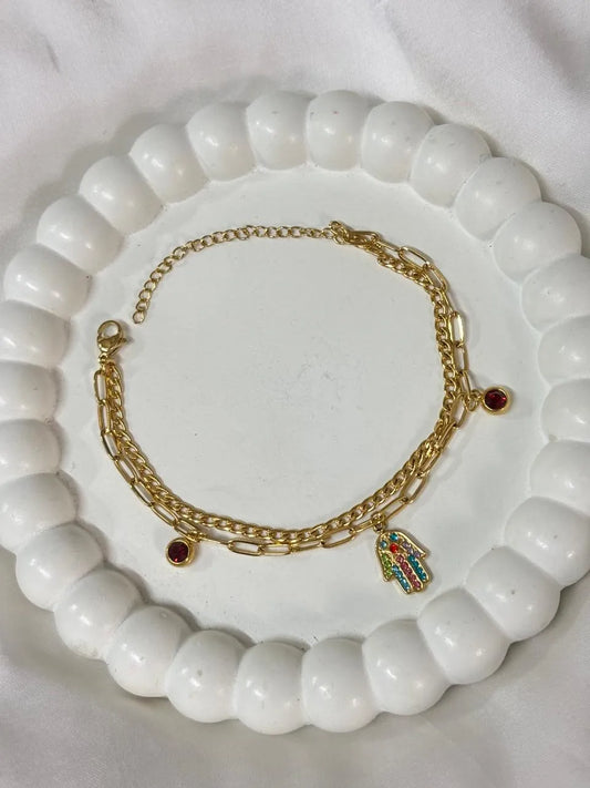 Gold Chain Bracelet with Charm and Red Gemstone Accents