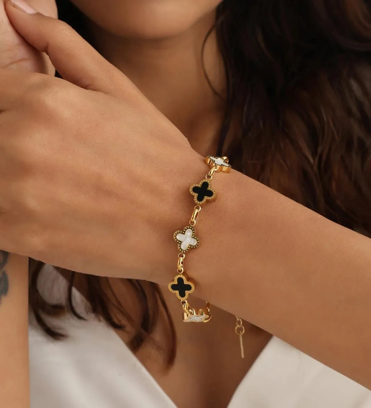 Elegant Gold-Plated Bracelet with Black and White Clovers